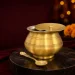 Pure Brass Plain Ghee Pot Festive Dining Ambiance on Dark Marble Platter with Marigolds